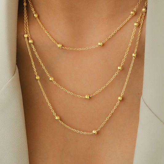 C701 Collar triple capa acero de titanio chapado en oro de 18k largo 24cm