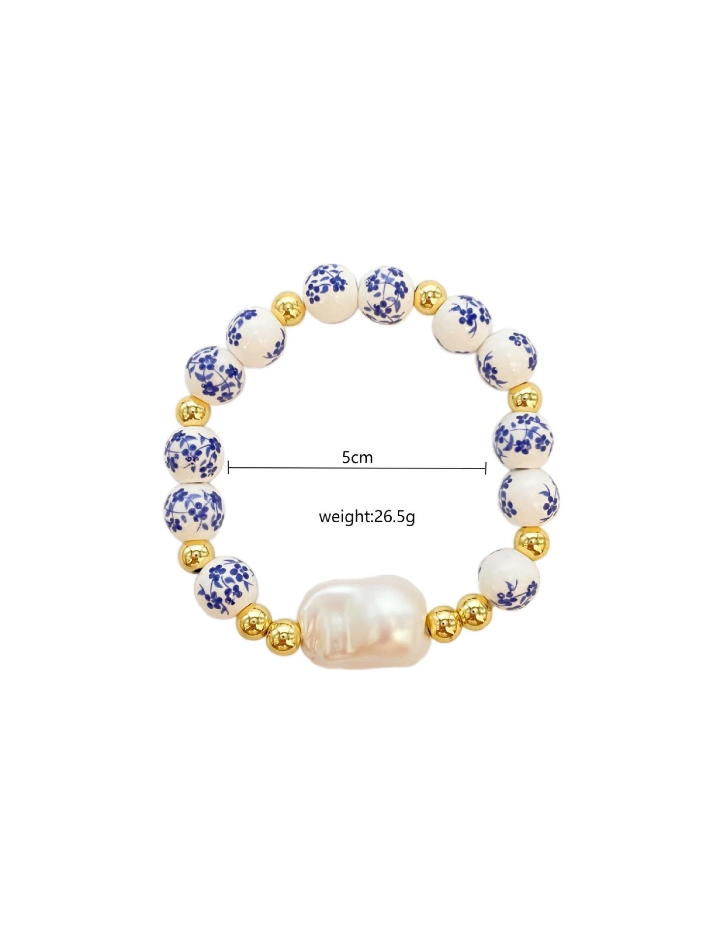 B299 Pulsera perla concha ceramica elastica
