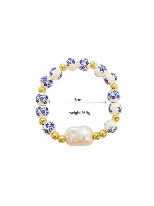 B299 Pulsera perla concha ceramica elastica