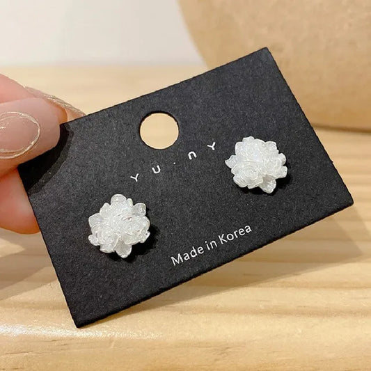 E3525 Aretes flor blanca aleacion 1cm