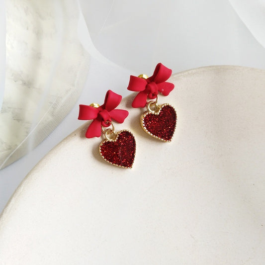 E3476 Aretes moño corazon rojo aleacion 2cm