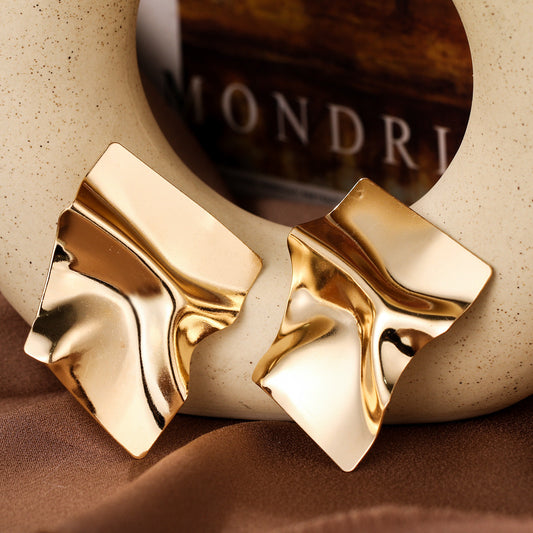 E7138 Aretes rectangular abstracto dorado aleacion 4cm