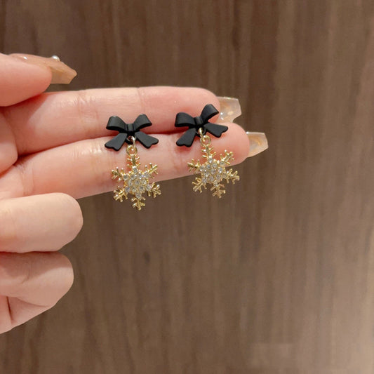 E4218 Aretes moño negro copo de nieve 1.5cm