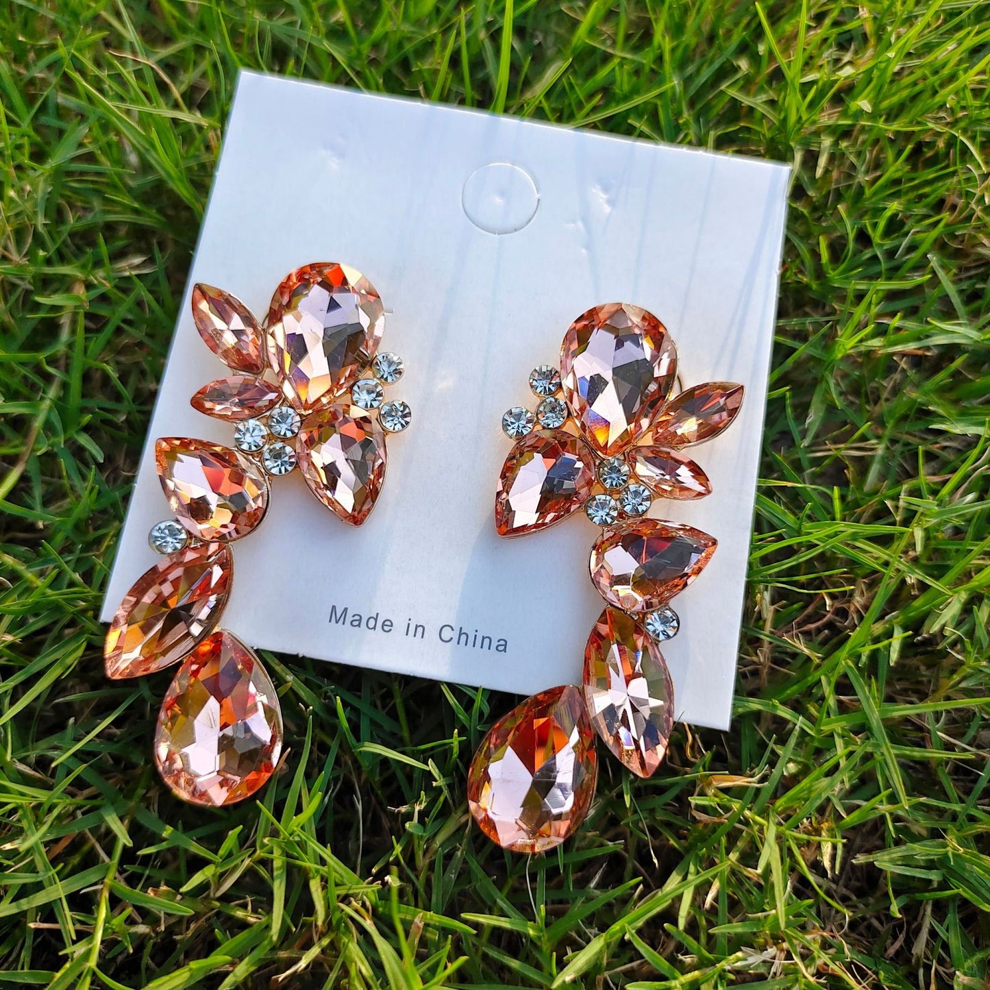 E3219 Aretes flor cristal color champan aleacion 6cm