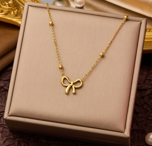 C1253 collar moño dorado acero inoxidable