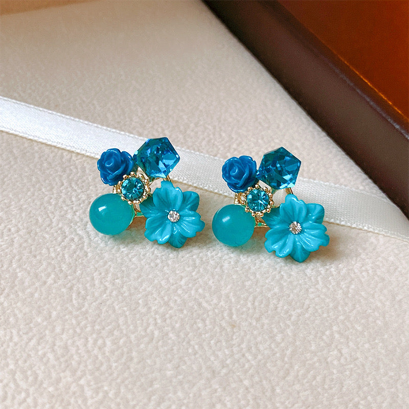 E7105 Aretes florales azules aleacion 2cm