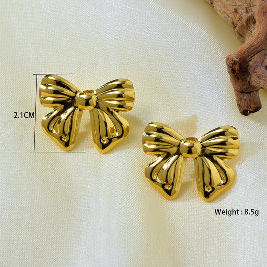 E3258 Aretes moño dorado acero inoxidable chapado en oro 18k 2.1cm