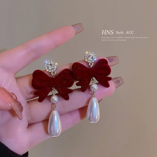 E4959 Aretes moño gamuza vino cristales brillantes 4cm