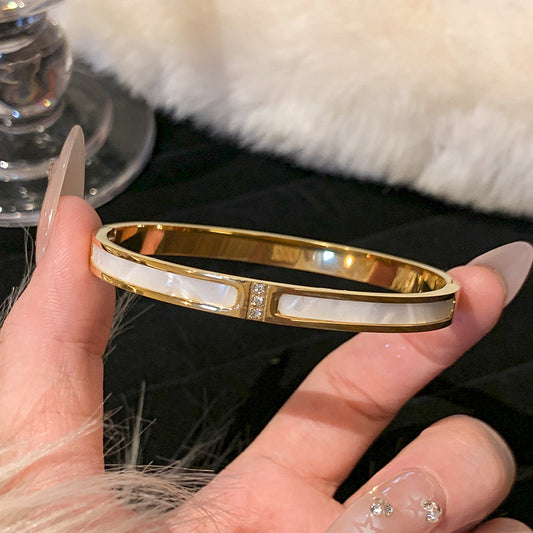 B424 Brazalete dorado con blanco acero titanio