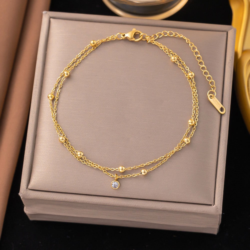 B676 Pulsera doble con bolitas doradas acero inoxidable 21cm