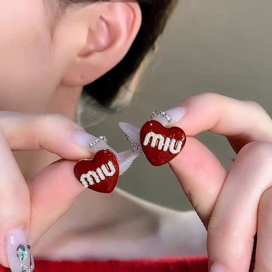 E7166 Aretes corazón miu miu aleacion 2cm