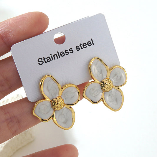 E7214 Aretes flore blanca contorno dorado elegante acero inoxidable 3cm