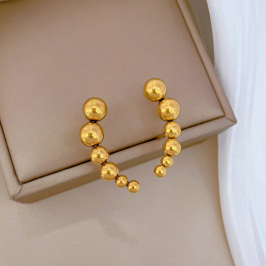 E3563 Aretes colgantes bolitas doradas acero de titanio3.3cm