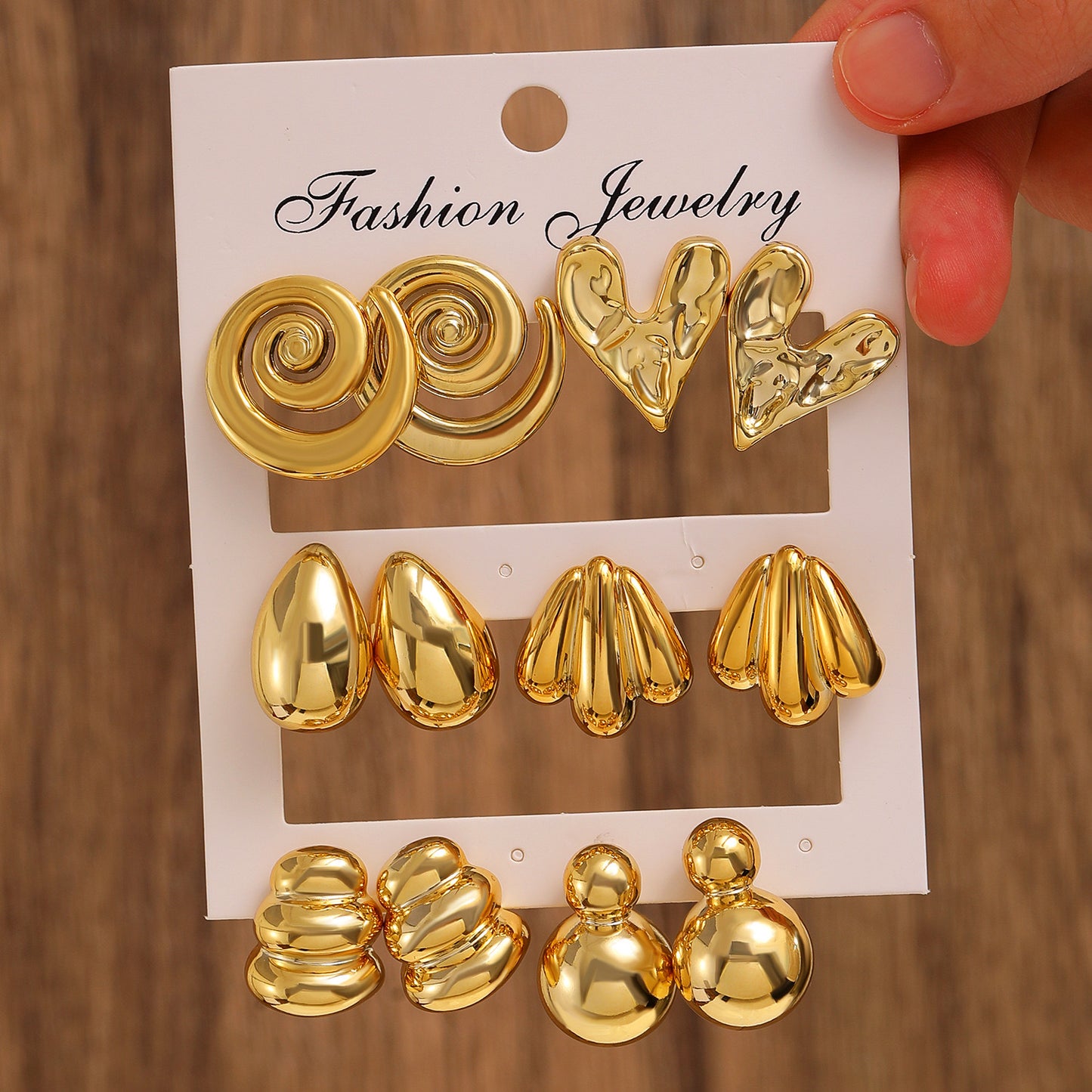 E5844 Conjunto aretes dorados caracol, corazon y gotas doradas chapados en oro de 14k 4cm aleacion