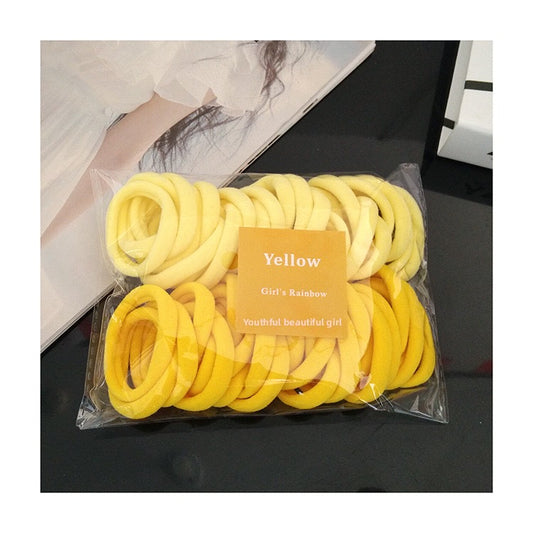 ACS02  Ligas para el cabello amarillas  incluye 50 piezas