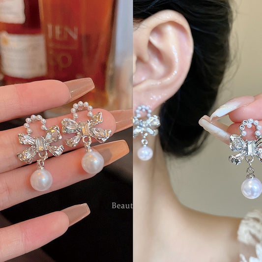 E4583 Aretes Perla moño aleacion 3cm