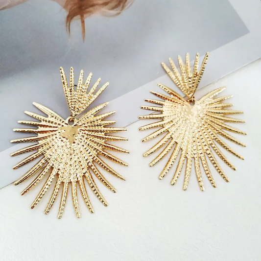 E3101D Aretes corazon sol rayos dorados aleacion 7cm
